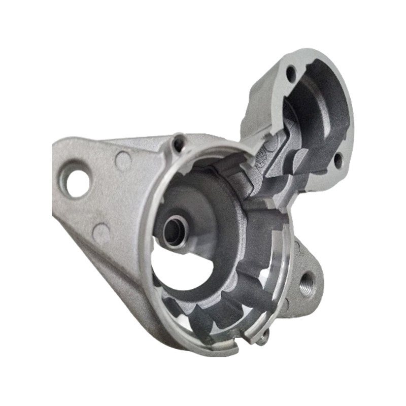 What contributions does the starter motor drive cover make in reducing noise and vibration?